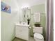 Bright bathroom featuring a vanity with sink and a decorative mirror at 2722 Brookhaven Ln, Buford, GA 30518