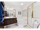 Bathroom featuring a shower, soaking tub, and dark wood vanity at 2722 Brookhaven Ln, Buford, GA 30518