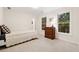 Cozy bedroom with natural light, a classic dresser, and neutral color scheme at 2722 Brookhaven Ln, Buford, GA 30518