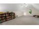 Spacious bonus room with a bookshelf and carpet at 2722 Brookhaven Ln, Buford, GA 30518