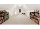 Large bonus room with ample space, neutral carpeting, and shelving at 2722 Brookhaven Ln, Buford, GA 30518