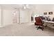 Spacious bonus room with an office setup and lots of natural light at 2722 Brookhaven Ln, Buford, GA 30518