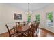 Elegant dining area with hardwood floors, chandelier, and bright natural light at 2722 Brookhaven Ln, Buford, GA 30518
