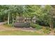 Charming two-story home with a welcoming front porch and beautifully landscaped front yard, surrounded by mature trees at 2722 Brookhaven Ln, Buford, GA 30518