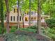 Beautiful two-story home with mature trees and a charming front porch at 2722 Brookhaven Ln, Buford, GA 30518