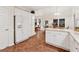 Spacious kitchen with white appliances, granite countertops, and a large pantry at 2722 Brookhaven Ln, Buford, GA 30518