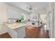 Bright kitchen with white cabinets, granite countertops, and stainless-steel appliances at 2722 Brookhaven Ln, Buford, GA 30518