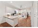 Bright kitchen featuring white cabinets, granite countertops, and stainless steel appliances at 2722 Brookhaven Ln, Buford, GA 30518