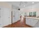 Eat-in kitchen featuring white cabinetry, granite countertops, and natural lighting at 2722 Brookhaven Ln, Buford, GA 30518