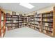 Spacious library featuring floor-to-ceiling bookshelves filled with books at 2722 Brookhaven Ln, Buford, GA 30518