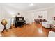 Open-concept living room and dining room with hardwood floors and plenty of natural light at 2722 Brookhaven Ln, Buford, GA 30518