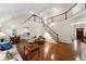 Open floor plan featuring high ceilings, wooden staircase and floors, and sun-filled rooms at 2722 Brookhaven Ln, Buford, GA 30518