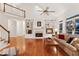 Spacious living room features a fireplace, built-in shelving, hardwood floors, and a second-floor landing at 2722 Brookhaven Ln, Buford, GA 30518