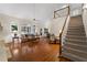 Bright, open living area featuring hardwood floors and access to a staircase at 2722 Brookhaven Ln, Buford, GA 30518