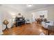 Cozy living room featuring a piano, hardwood floors, and elegant furnishings at 2722 Brookhaven Ln, Buford, GA 30518