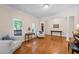 Bright living room with hardwood floors, neutral walls, and large windows at 2722 Brookhaven Ln, Buford, GA 30518