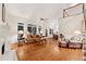 Bright and airy living room with fireplace, vaulted ceilings, hardwood floors, and combined dining area at 2722 Brookhaven Ln, Buford, GA 30518
