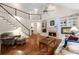 Open living space featuring a fireplace, built-in shelves, and a soaring ceiling at 2722 Brookhaven Ln, Buford, GA 30518