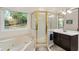 Beautiful main bathroom with a soaking tub, a glass shower, and double vanity sinks at 2722 Brookhaven Ln, Buford, GA 30518