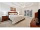 Spacious bedroom with tray ceiling, carpet floors, and large windows at 2722 Brookhaven Ln, Buford, GA 30518
