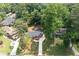 A high angle view of a home and surrounding greenery showing roof and driveway at 3590 Lee Se St, Smyrna, GA 30080