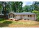 Backyard view of the home featuring a covered back porch at 3590 Lee Se St, Smyrna, GA 30080