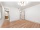 Bright bedroom with hardwood floors and stylish modern lighting fixture at 3590 Lee Se St, Smyrna, GA 30080