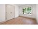 Bright bedroom with hardwood floors and large window at 3590 Lee Se St, Smyrna, GA 30080