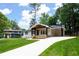 Beautiful home featuring a spacious driveway and inviting front entrance with lovely curb appeal at 3590 Lee Se St, Smyrna, GA 30080