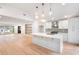 Open kitchen and living area featuring island, recessed lights, and modern appliances at 3590 Lee Se St, Smyrna, GA 30080