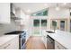 Modern kitchen with stainless steel appliances, island with seating, and ample cabinet space at 3590 Lee Se St, Smyrna, GA 30080