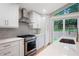 Modern kitchen with stainless appliances and large island at 3590 Lee Se St, Smyrna, GA 30080
