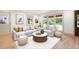 Bright living room with hardwood floors, neutral decor, large windows, and comfortable seating for entertaining at 3590 Lee Se St, Smyrna, GA 30080