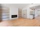 Open living room with fireplace, custom shelving, and wet bar area at 3590 Lee Se St, Smyrna, GA 30080