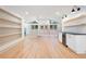 Spacious living area featuring hardwood floors, mini fridge, and modern recessed lighting at 3590 Lee Se St, Smyrna, GA 30080