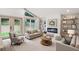 Cozy living room with high ceilings, lots of natural light, hardwood floors, fireplace, and built-in shelves at 3590 Lee Se St, Smyrna, GA 30080