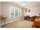 Comfortable bedroom with a desk, chair, and a piano, providing a peaceful space for work and relaxation at 13042 Dartmore Ave, Alpharetta, GA 30005