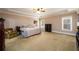 Generous bedroom with tray ceiling, carpeted floors, and natural light at 13042 Dartmore Ave, Alpharetta, GA 30005
