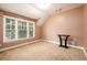 Bright room with large windows that let in natural light, along with plush carpet at 13042 Dartmore Ave, Alpharetta, GA 30005