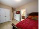 Spacious bedroom featuring a walk in closet, plush carpet, and a ceiling fan at 13042 Dartmore Ave, Alpharetta, GA 30005
