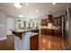 Spacious kitchen with dark wood cabinetry, granite countertops, and stainless-steel appliances at 13042 Dartmore Ave, Alpharetta, GA 30005