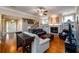 Spacious living room with fireplace, hardwood floors, and staircase leading to the second floor at 13042 Dartmore Ave, Alpharetta, GA 30005