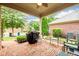Enjoy outdoor living on this spacious patio with seating and lush landscaping at 13042 Dartmore Ave, Alpharetta, GA 30005