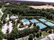 Aerial view of the community featuring a pool and tennis courts for recreation at 158 South Village Ave, Holly Springs, GA 30115