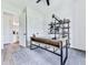 Bright home office with modern desk, open shelving, and luxury vinyl plank flooring at 158 South Village Ave, Holly Springs, GA 30115