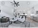 Open-concept living room that connects to the kitchen, boasting modern finishes and abundant natural light at 158 South Village Ave, Holly Springs, GA 30115