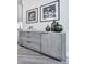 Comfortable living space with modern console table and decorative artwork above at 158 South Village Ave, Holly Springs, GA 30115