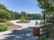 Community pool surrounded by lush greenery and comfortable seating, perfect for relaxation and recreation at 158 South Village Ave, Holly Springs, GA 30115