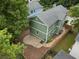 Aerial view of a green home with a fenced backyard and stone patio at 187 Vanira Se Ave, Atlanta, GA 30315