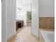 Bathroom with tile flooring leading to sink and tub/shower at 187 Vanira Se Ave, Atlanta, GA 30315